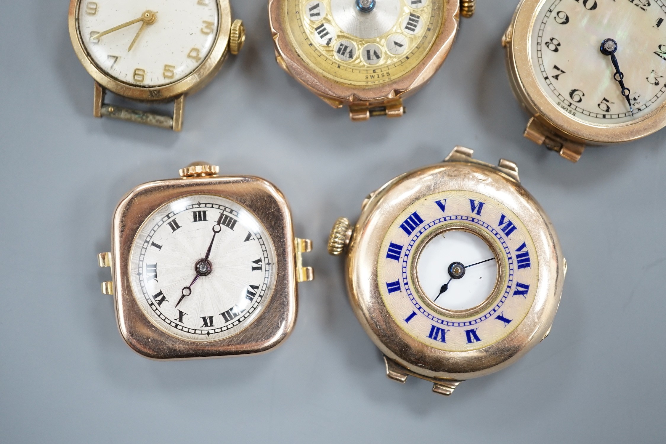 Four assorted lady's mainly early to mid 20th century 9ct gold manual wind wrist watches, including Vertex & Zenith and one other yellow metal wrist watch, all lacking straps.